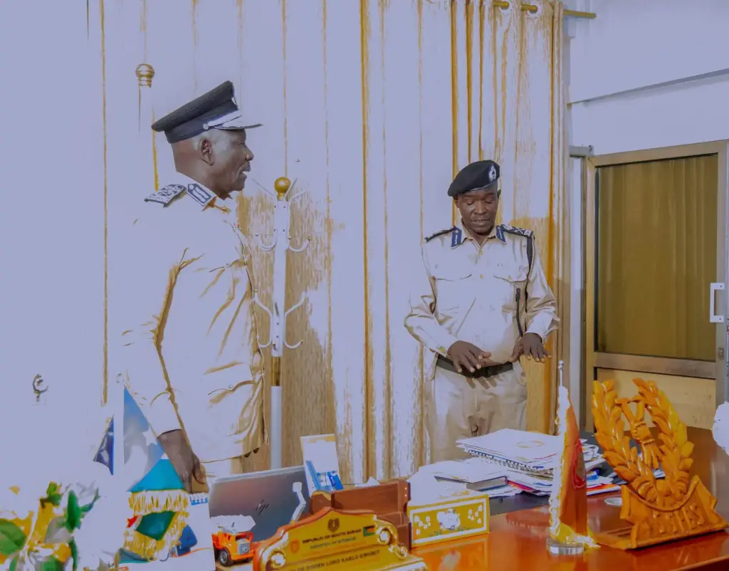 NCDS officers coordinating operations from the command office in Juba, with the national flag displayed