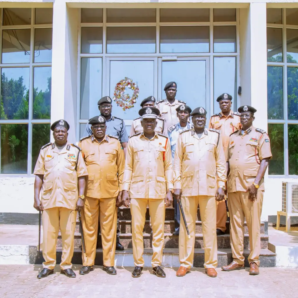 NCDS leadership standing together on the steps of Service headquarters in Juba